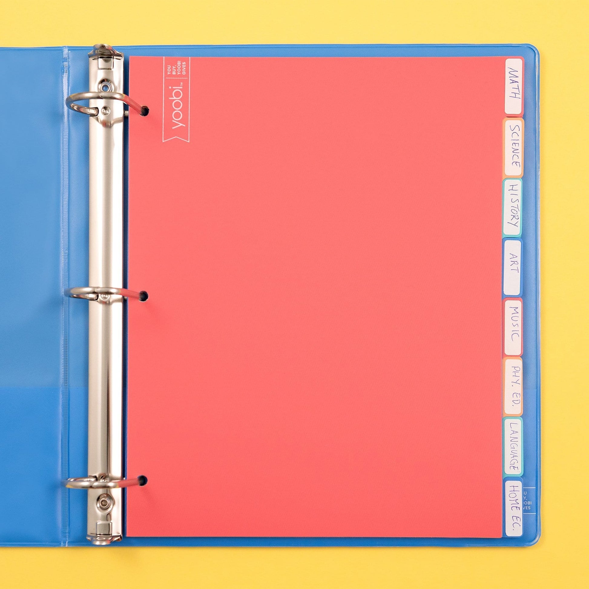 8 tab dividers shown inside of open 3-ring binder, shown with handwritten labels on tabs