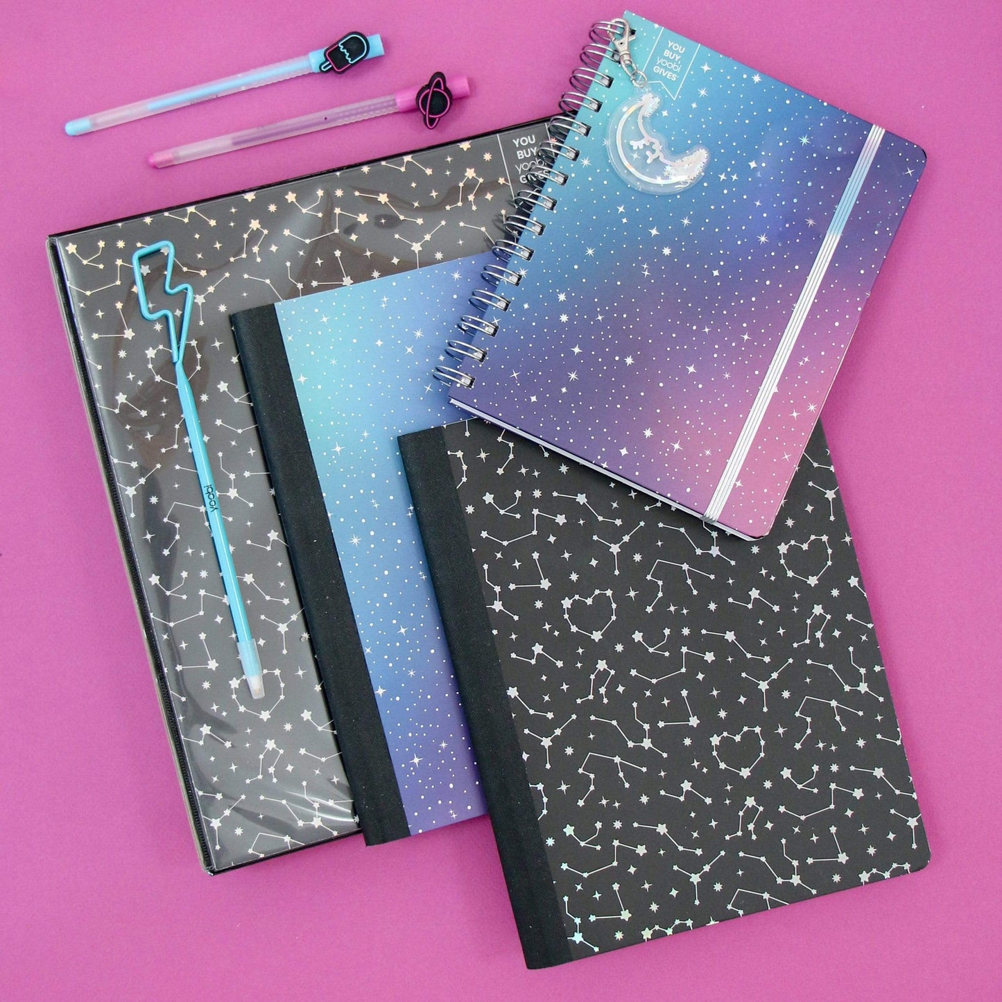 lifestyle image of space galaxy planner, celestial and space galaxy composition books and celestial binder