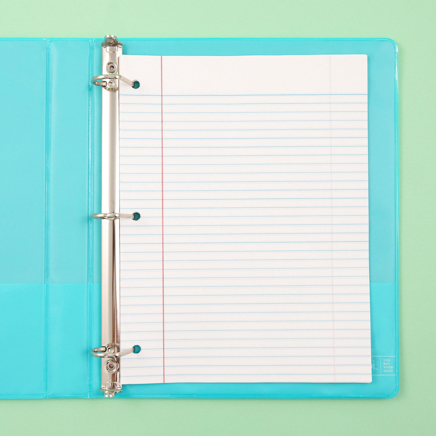 inside of open mint 3-ring binder showing inside pockets on both sides and 3-hole punched college-ruled paper inside binder