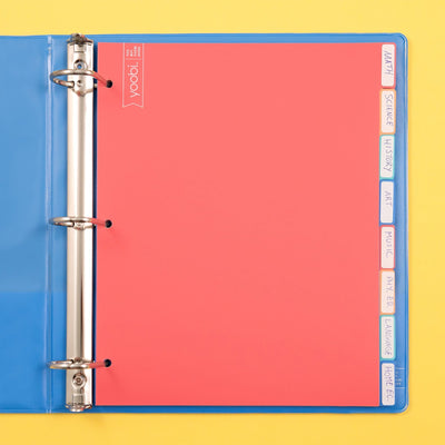  8 tab dividers shown inside of open 3-ring binder, shown with handwritten labels on tabs
