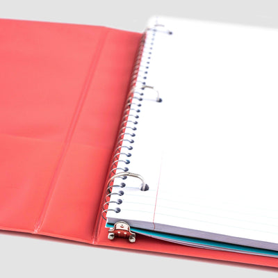 inside of open coral ombre 3-ring 1" binder showing D-ring detail and spiral notebook inside of binder