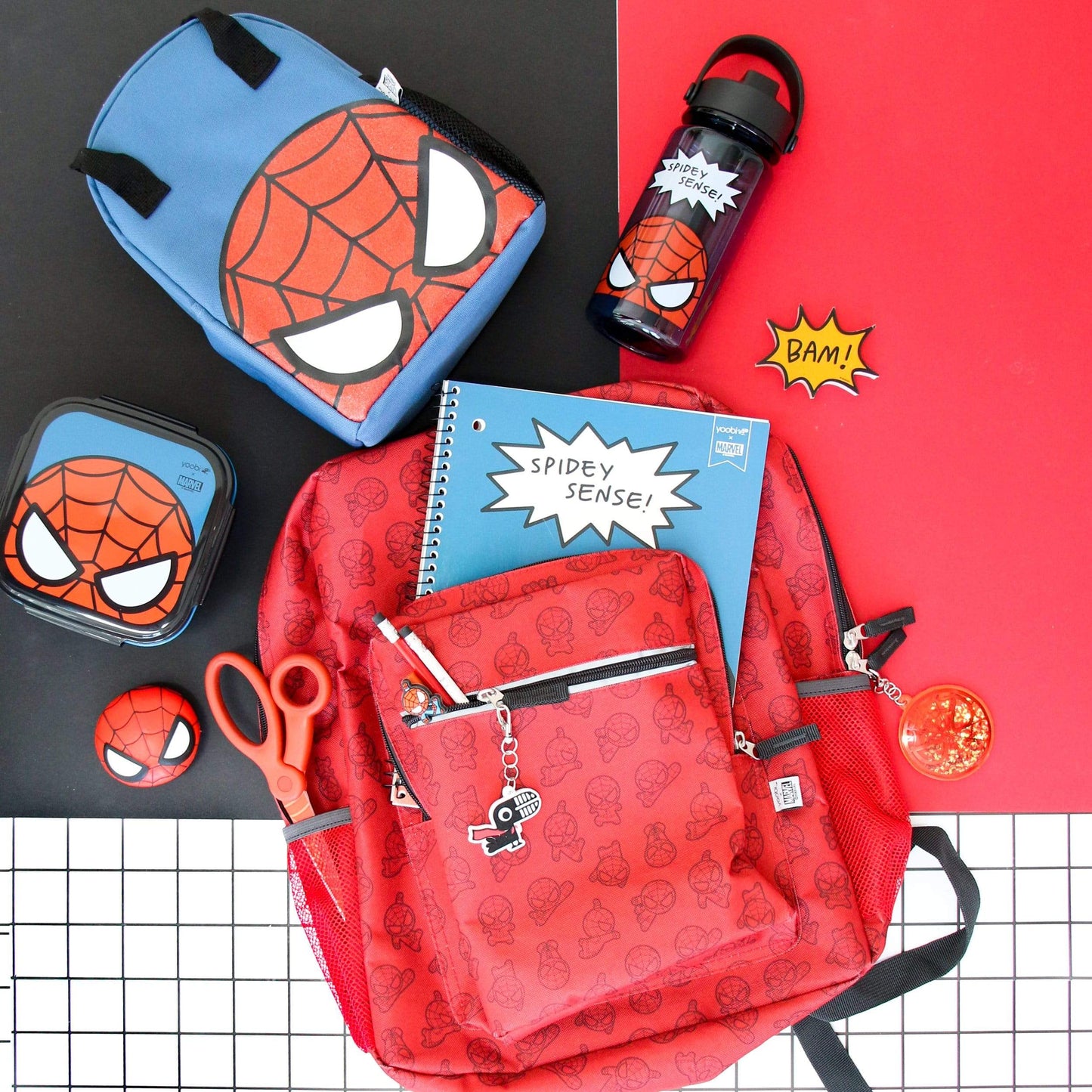 lifestyle image of Spider-Man water bottle shown with Spider-Man backpack, lunch bag and other Spider-Man school supplies