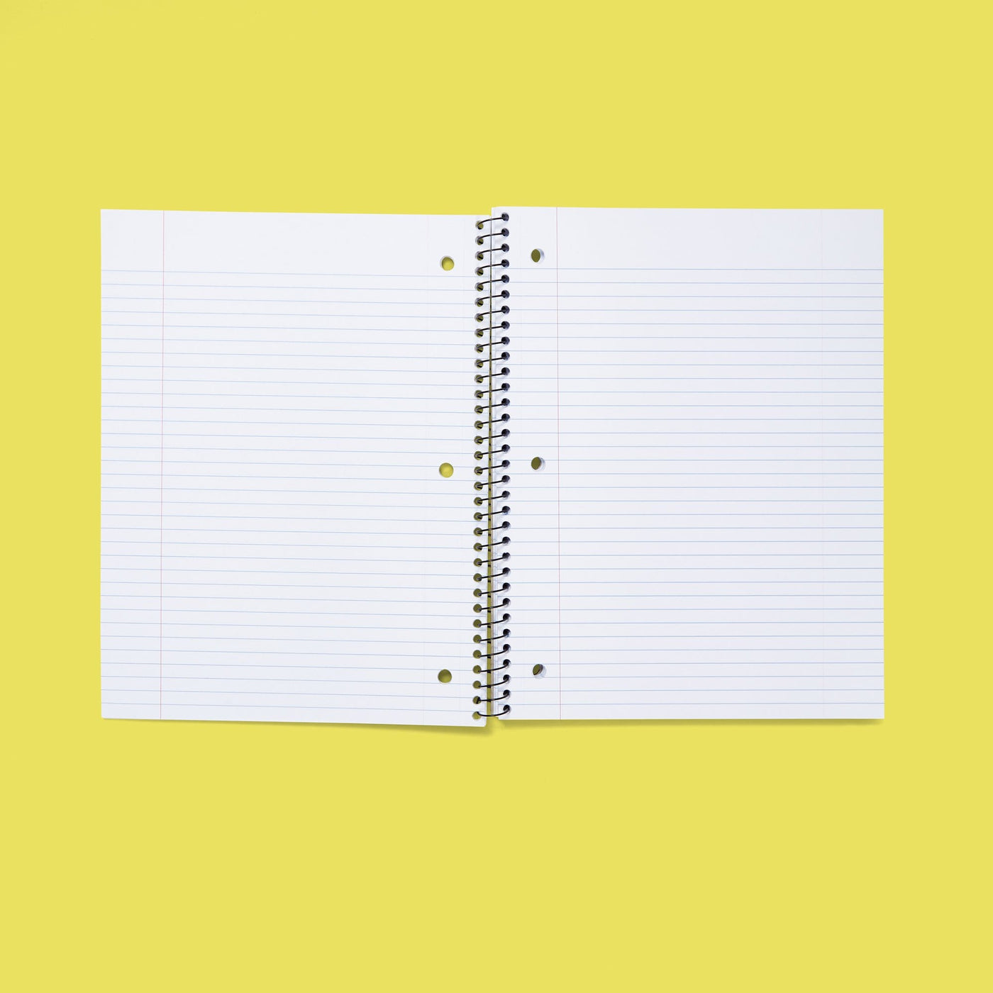 inside of open one subject spiral notebook showing college-ruled paper