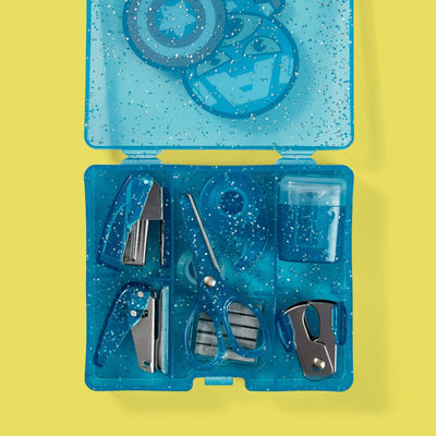 inside of Captain America mini supply kit showing scissors, stapler, hole punch, staples, staple remover, tape, tape dispenser and pencil sharpener, blue glitter
