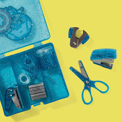 inside of Captain America mini supply kit showing scissors, stapler, hole punch, staples, staple remover, tape, tape dispenser and pencil sharpener, blue glitter